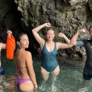 Candid Outdoor Group Photo in Natural Pool